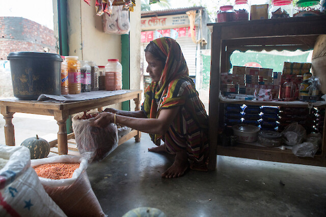 Khadija is happier now because she runs her own grocery shop, which allows her more independence. She can earn as much as she used to.